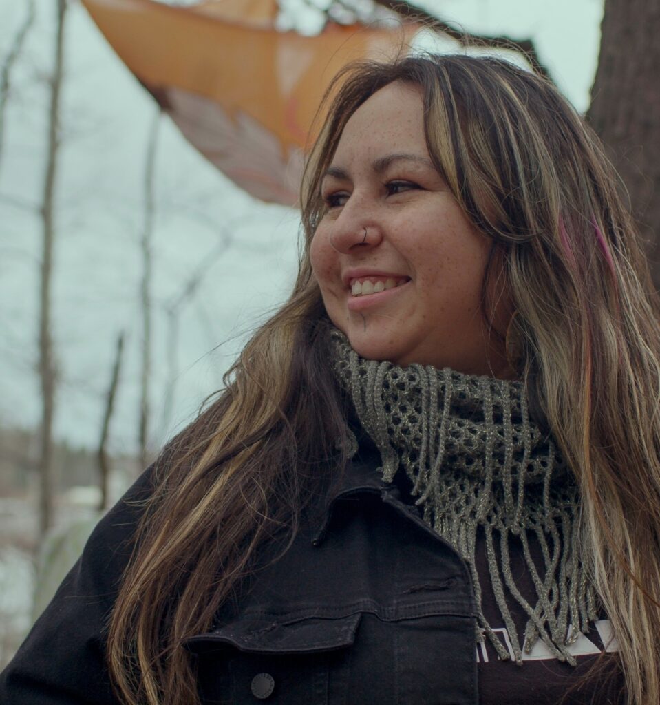 Indigenous woman standing strong.